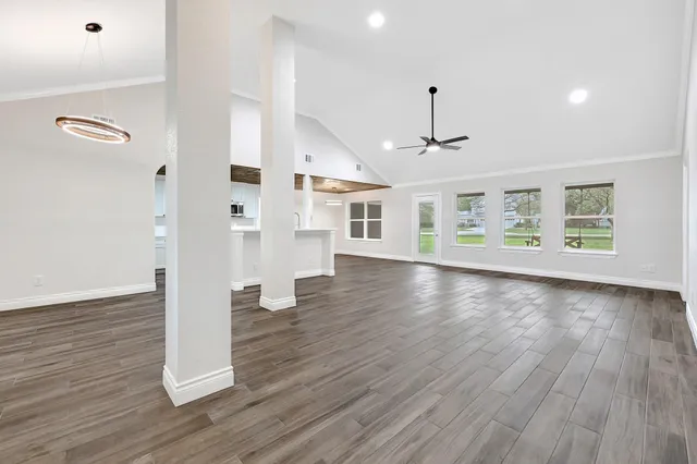a view of an entryway with wooden floor
