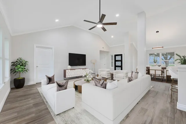 a living room with furniture and a flat screen tv