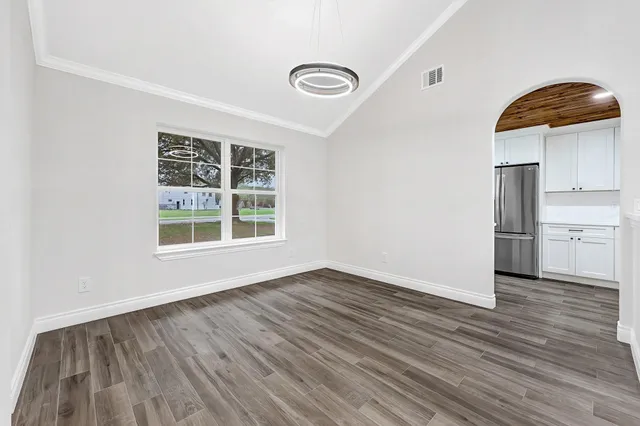 a view of kitchen and wooden floor