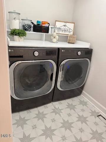a utility room with dryer and washer