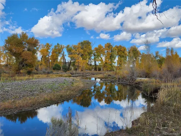 a view of a lake view with houses in back