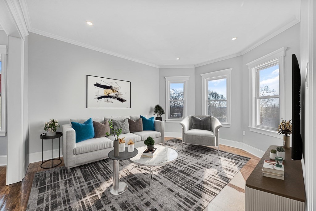 44 Bowdoin Street, Unit 2 Boston, MA 02124 - Photo 1 of 33 a living room with furniture and a large window