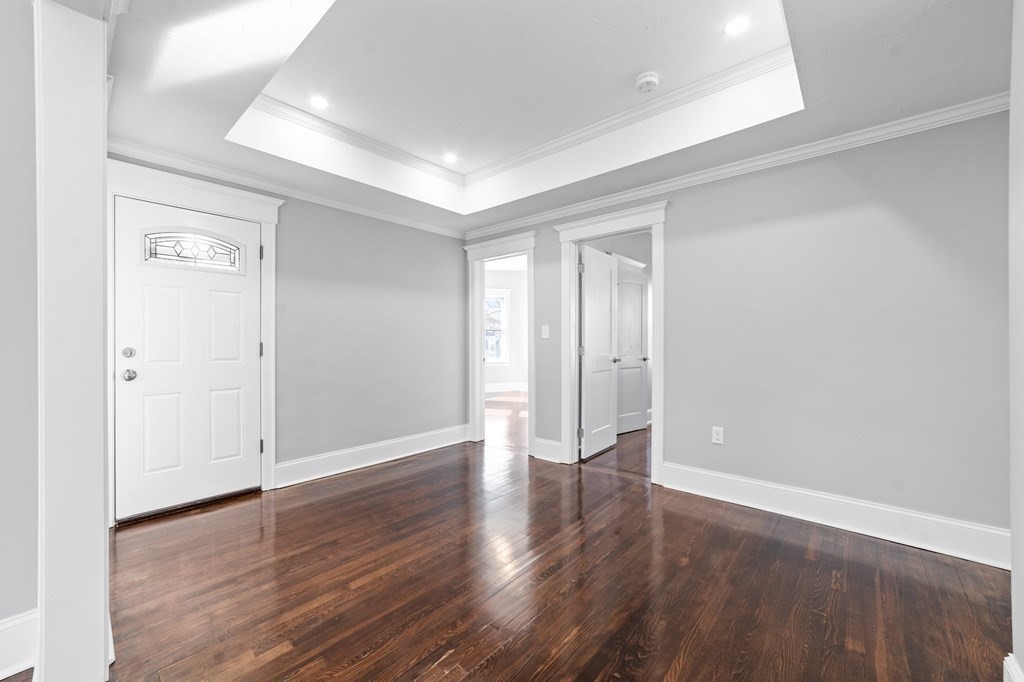 44 Bowdoin Street, Unit 2 Boston, MA 02124 - Photo 18 of 33 wooden floor in an empty room