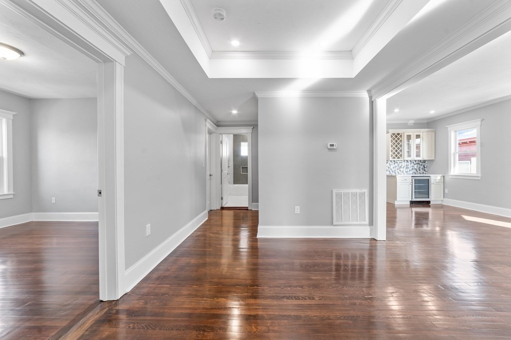 44 Bowdoin Street, Unit 2 Boston, MA 02124 - Photo 19 of 33 a view of empty room with wooden floor