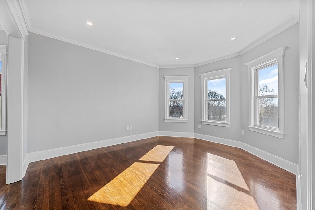44 Bowdoin Street, Unit 2 Boston, MA 02124 - Photo 2 of 33 an empty room with windows