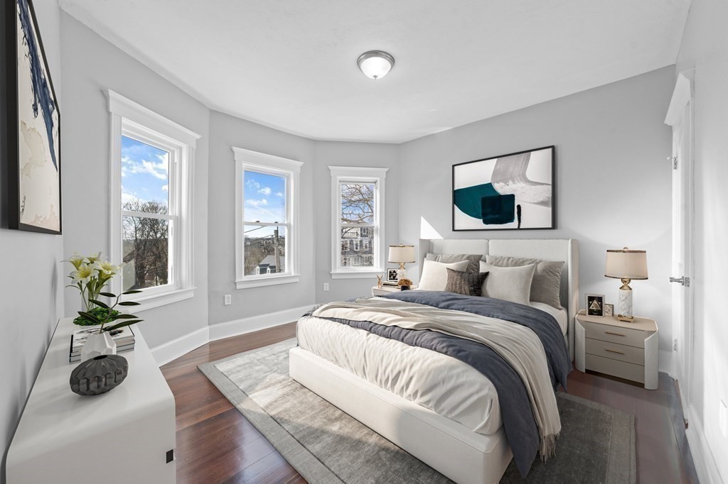 44 Bowdoin Street, Unit 2 Boston, MA 02124 - Photo 21 of 33 a bedroom with a bed and large window