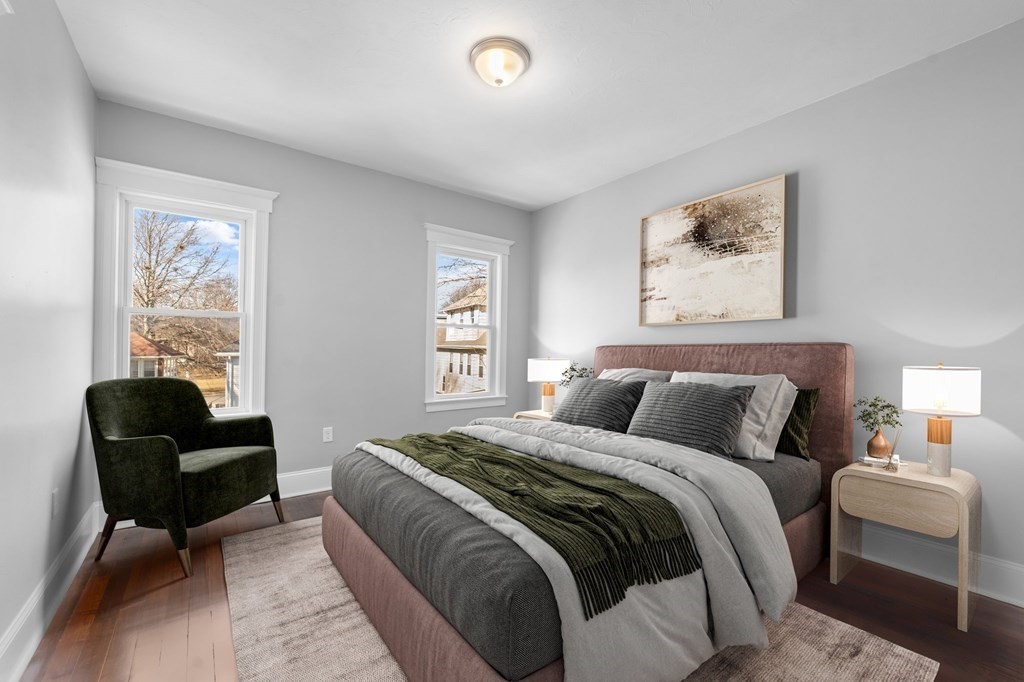 44 Bowdoin Street, Unit 2 Boston, MA 02124 - Photo 23 of 33 a bedroom with a bed and a couch