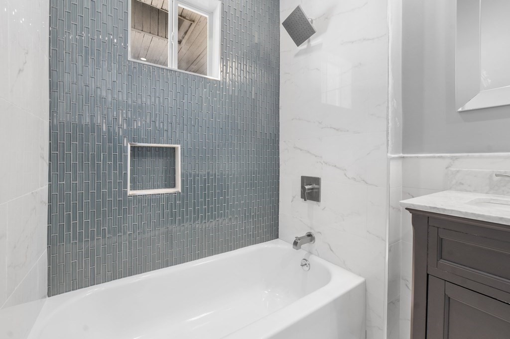 44 Bowdoin Street, Unit 2 Boston, MA 02124 - Photo 30 of 33 a bathroom with a sink and a bathtub
