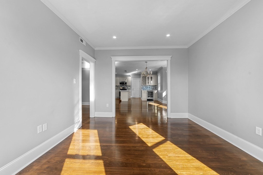 44 Bowdoin Street, Unit 2 Boston, MA 02124 - Photo 5 of 33 a hallway with wooden floor