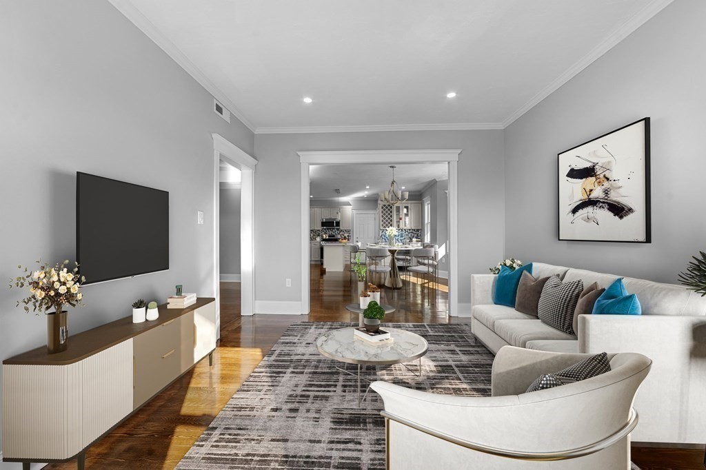 44 Bowdoin Street, Unit 2 Boston, MA 02124 - Photo 6 of 33 a living room with furniture and a flat screen tv