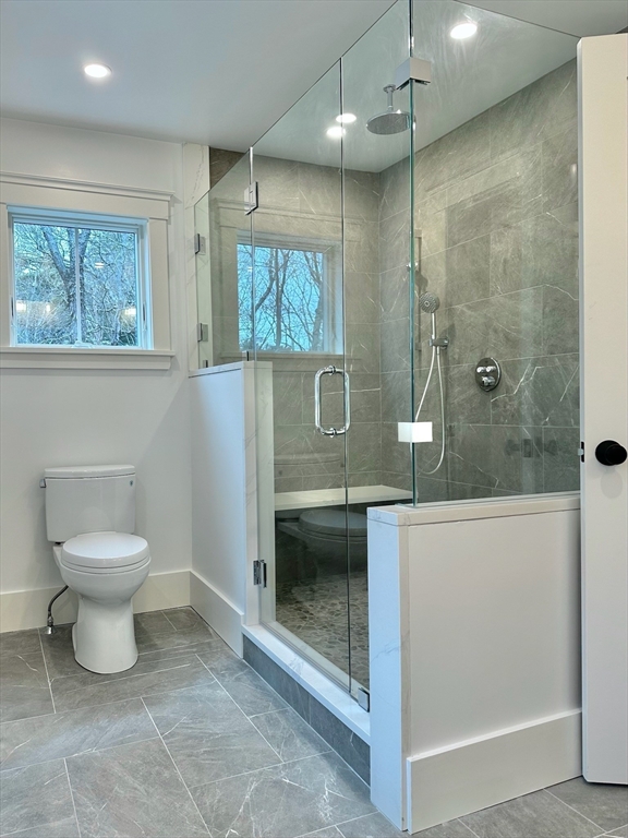 16 R Eldor Drive Walpole, MA 02071 - Photo 13 of 28 a bathroom with a toilet a sink and mirror