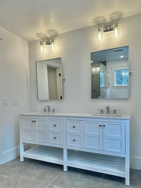 16 R Eldor Drive Walpole, MA 02071 - Photo 14 of 28 a bathroom with double vanity and a mirror