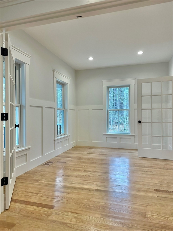 16 R Eldor Drive Walpole, MA 02071 - Photo 4 of 28 a view of empty room with wooden floor and fan