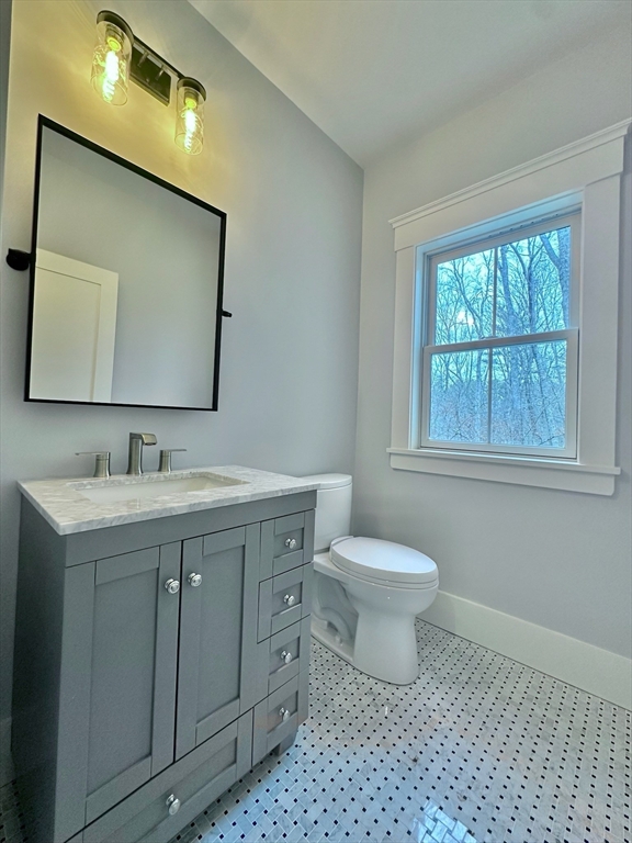 16 R Eldor Drive Walpole, MA 02071 - Photo 9 of 28 a bathroom with a toilet sink and mirror