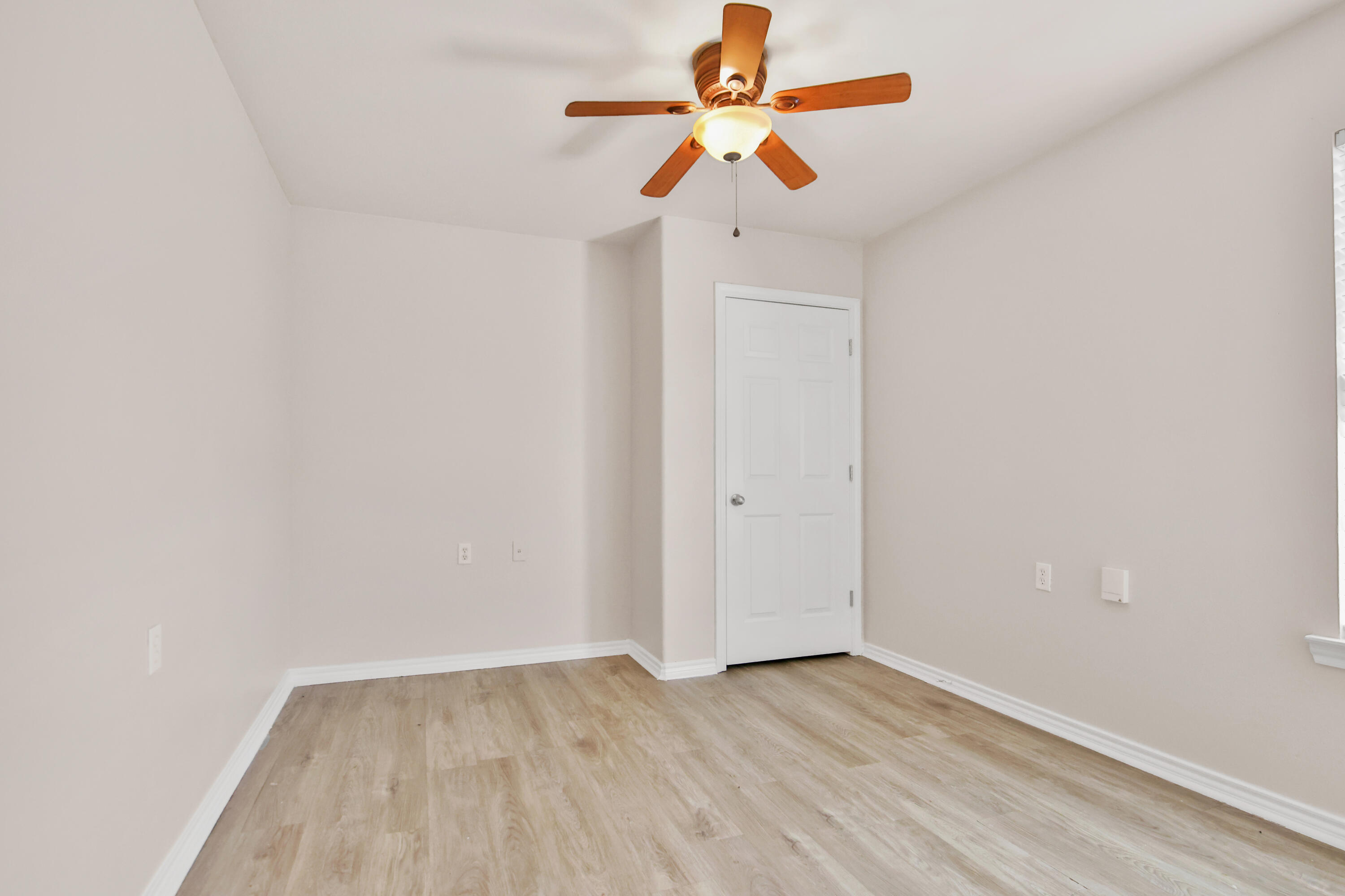 2117 99th Street Lubbock, TX 79423 - Photo 14 of 30 an empty room with a window and a ceiling fan