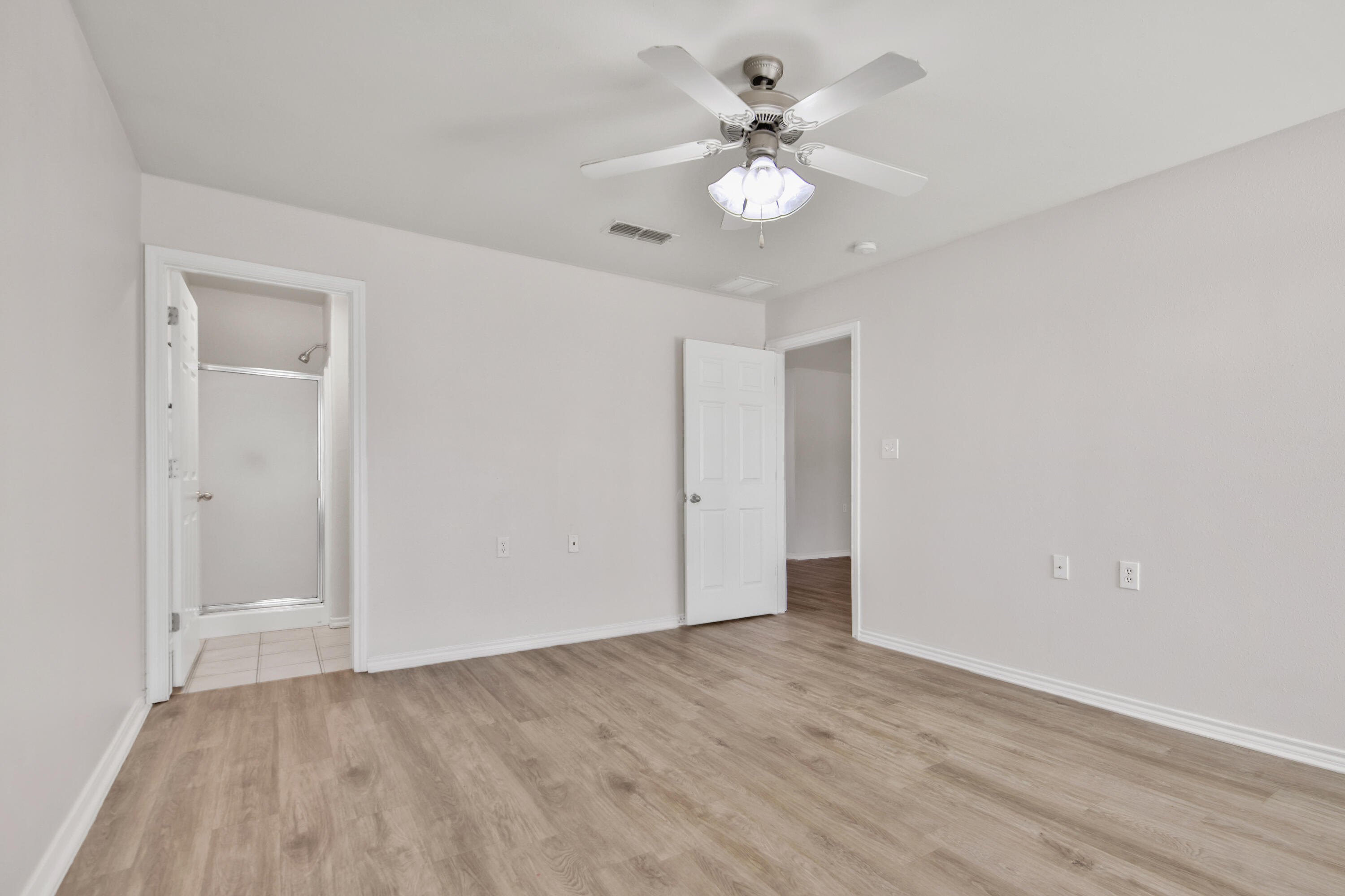 2117 99th Street Lubbock, TX 79423 - Photo 24 of 30 a view of an empty room with wooden floor