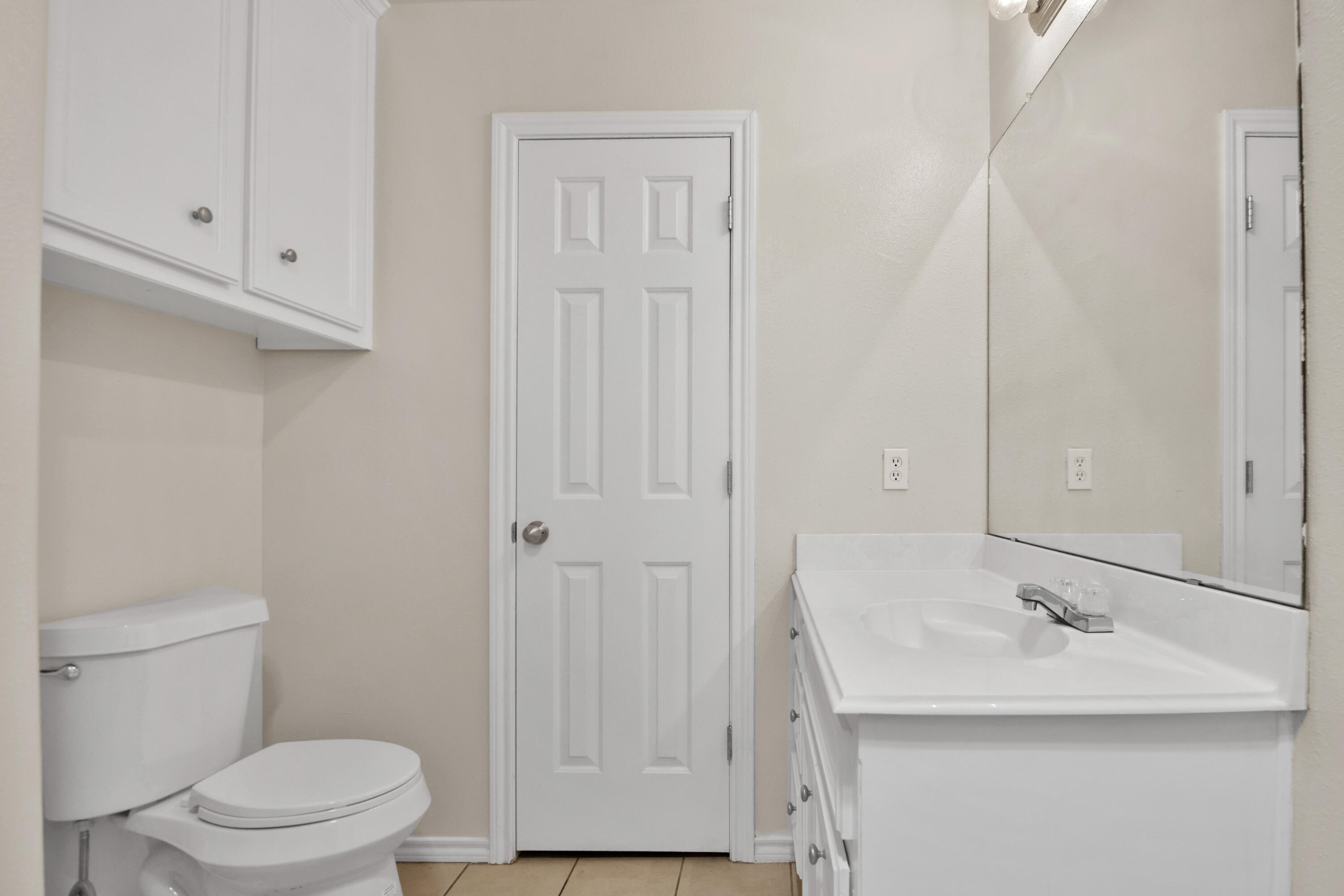 2117 99th Street Lubbock, TX 79423 - Photo 27 of 30 a bathroom with a sink and a toilet