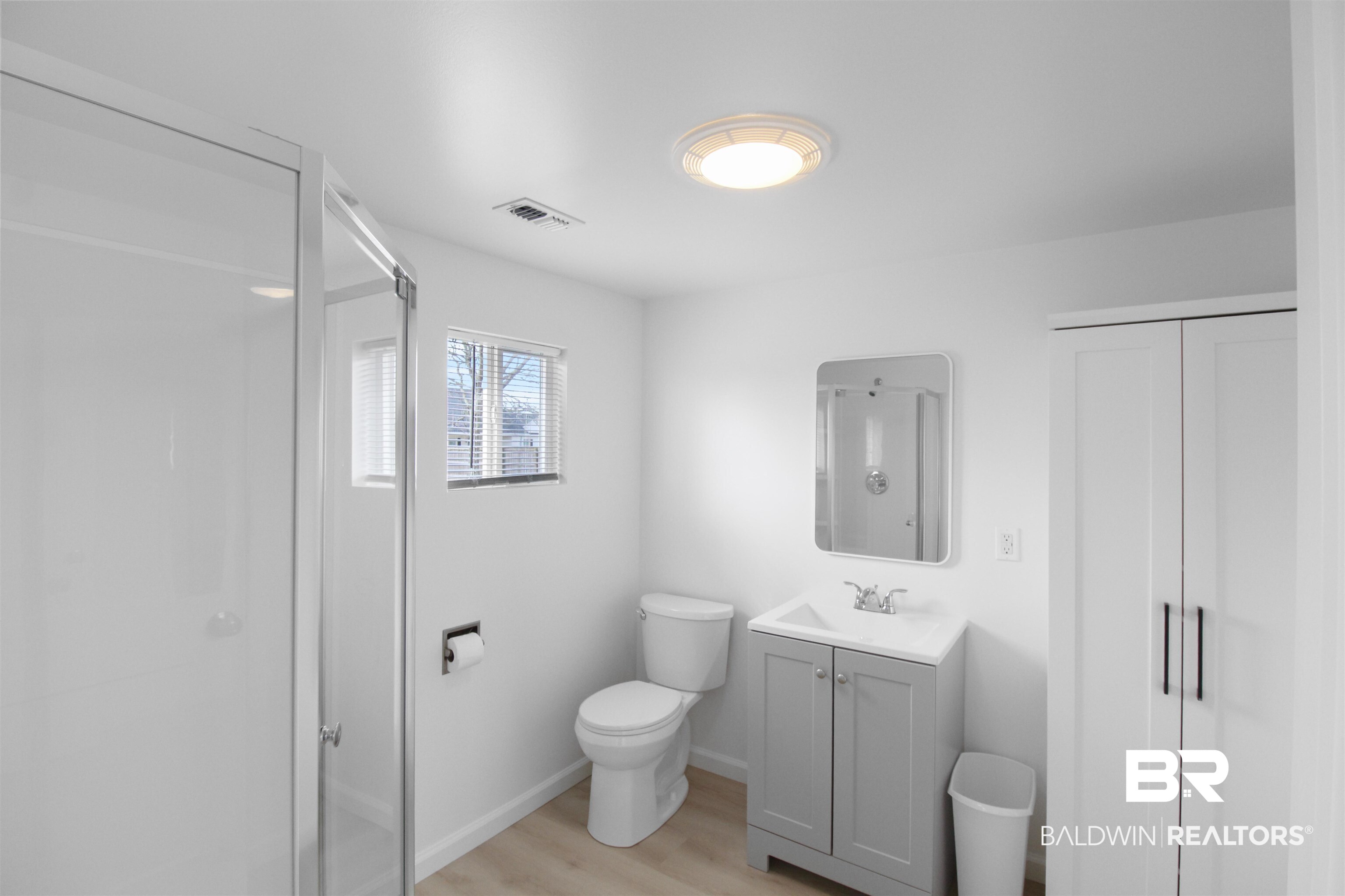 17622 Brewer Road Foley, AL 36535 - Photo 3 of 26 Full bathroom featuring a shower stall, vanity, light wood-style floors, and a closet