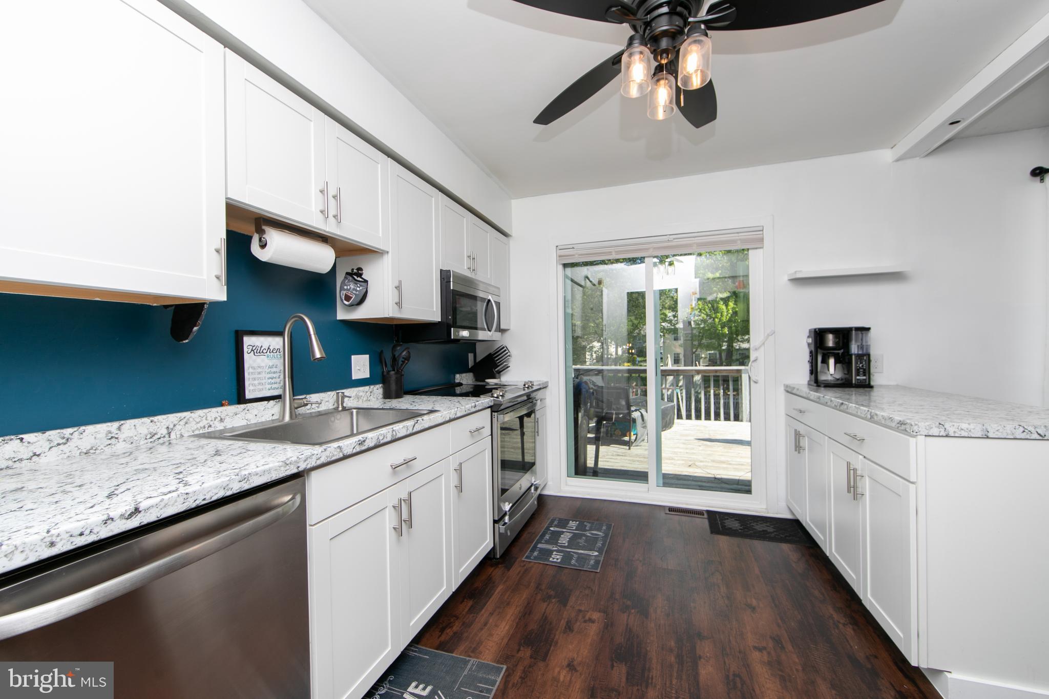 64 Tarnsfield Road Westampton, NJ 08060 - Photo 11 of 41 a large kitchen with stainless steel appliances granite countertop a lot of counter space and wooden floor