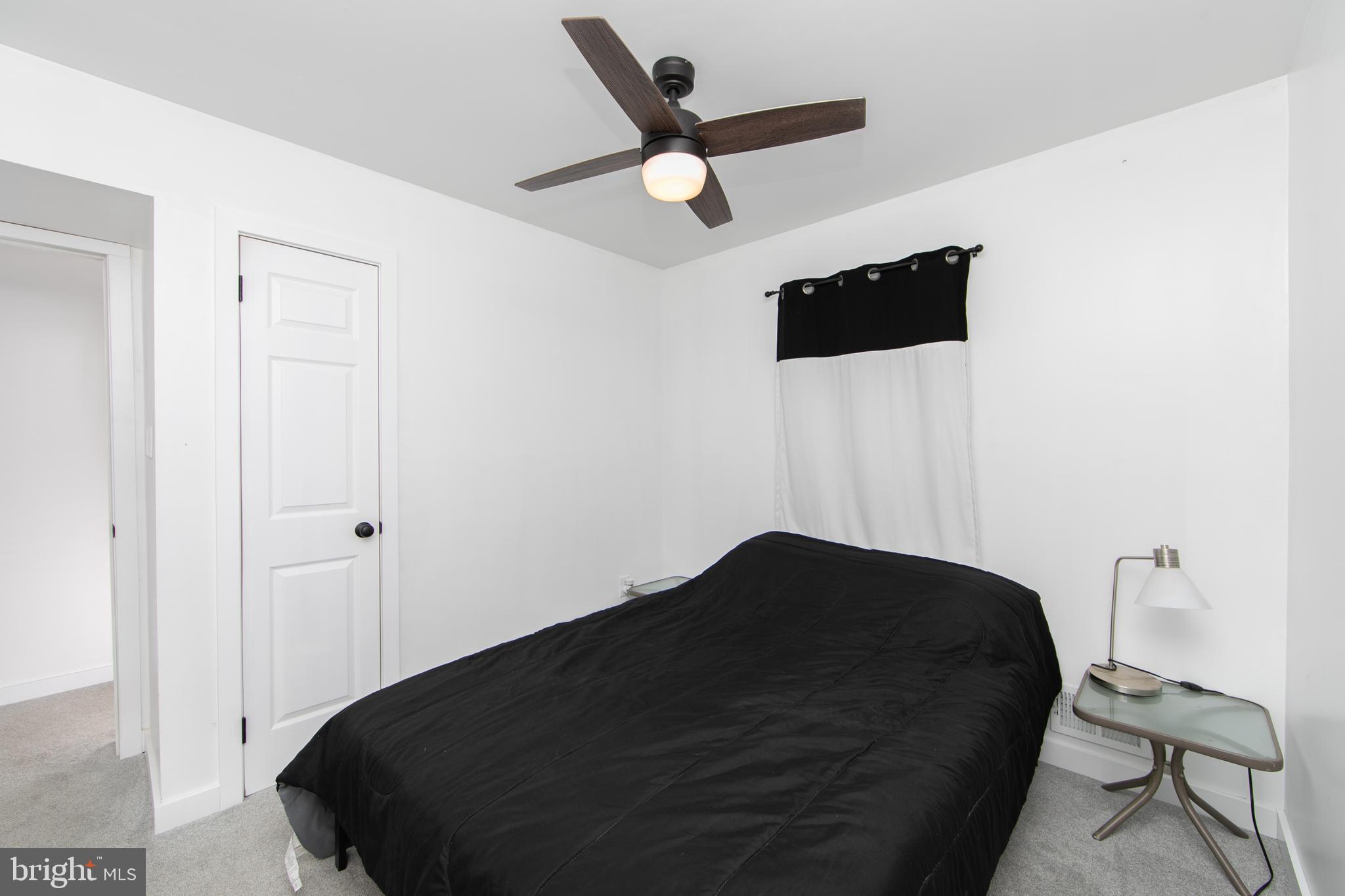 64 Tarnsfield Road Westampton, NJ 08060 - Photo 27 of 41 a living room with a bed furniture and a ceiling fan
