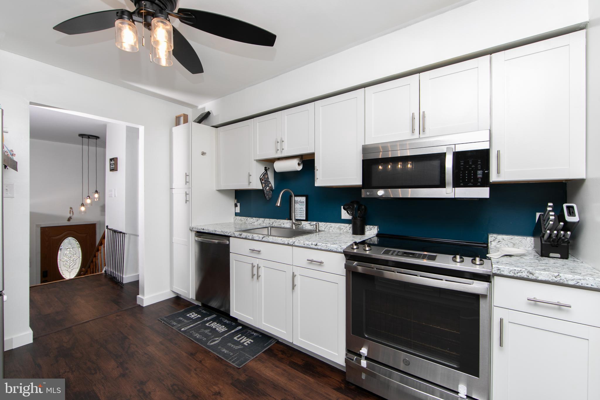 64 Tarnsfield Road Westampton, NJ 08060 - Photo 10 of 41 a kitchen with a stove and a microwave