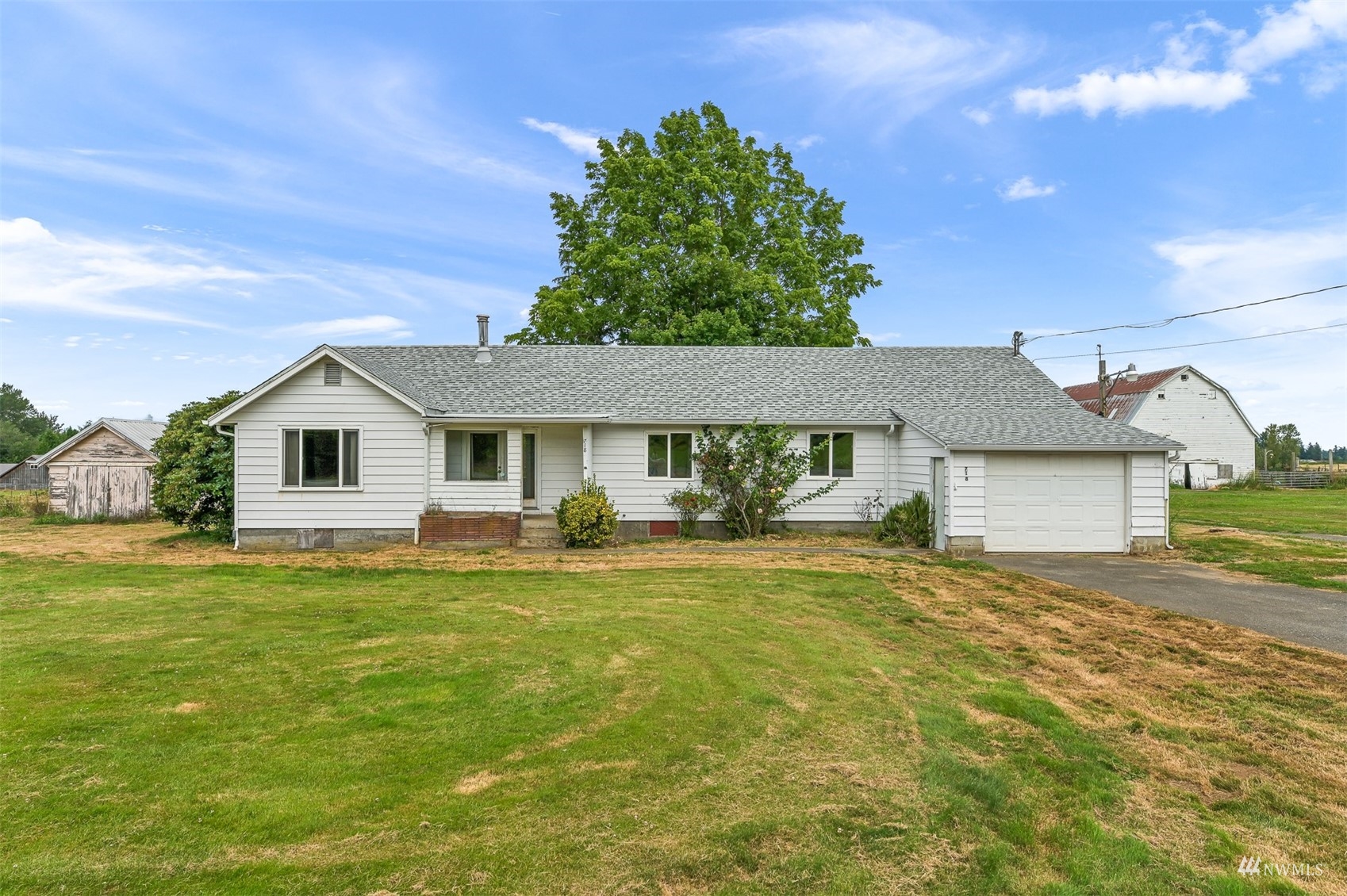 718 East Laurel Road Bellingham, WA 98226 - Photo 18 of 40 a front view of a house with a yard