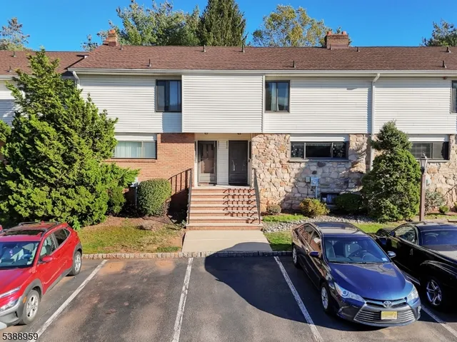 a view of a patio with couches table and chairs and potted plants