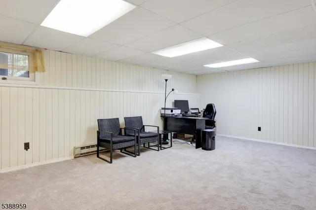 a view of a workspace with furniture