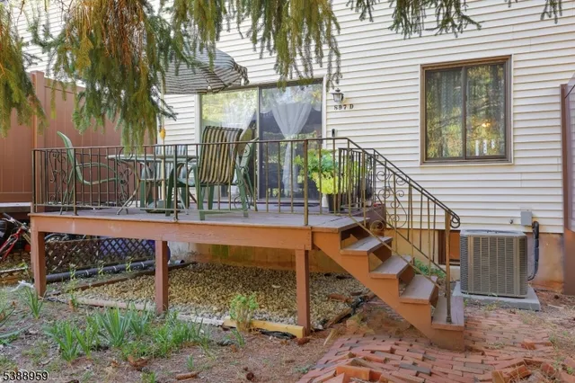 a view of wooden house with a wooden fence