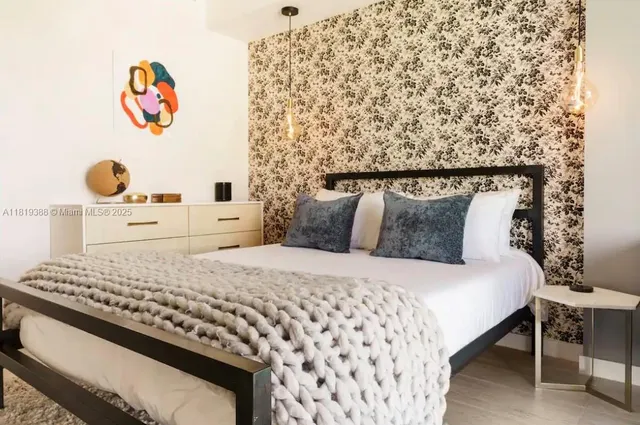 a bedroom with a bed and dresser