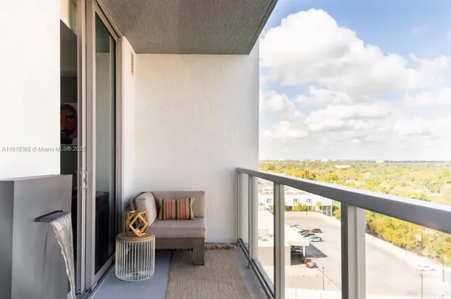 a view of a room with wooden floor and chair