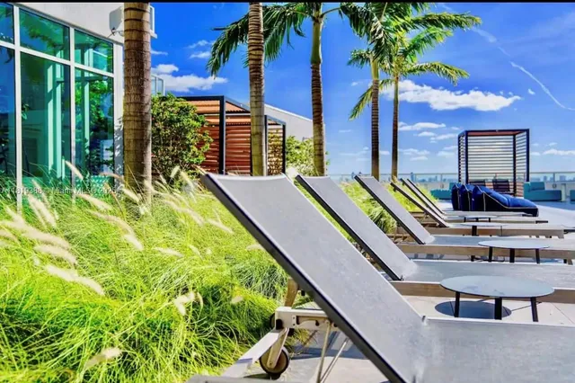 a front view of a house with a swimming pool