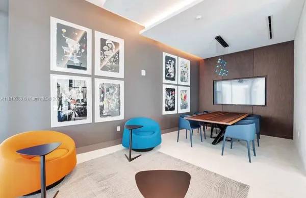 a living room with furniture a rug and a large window