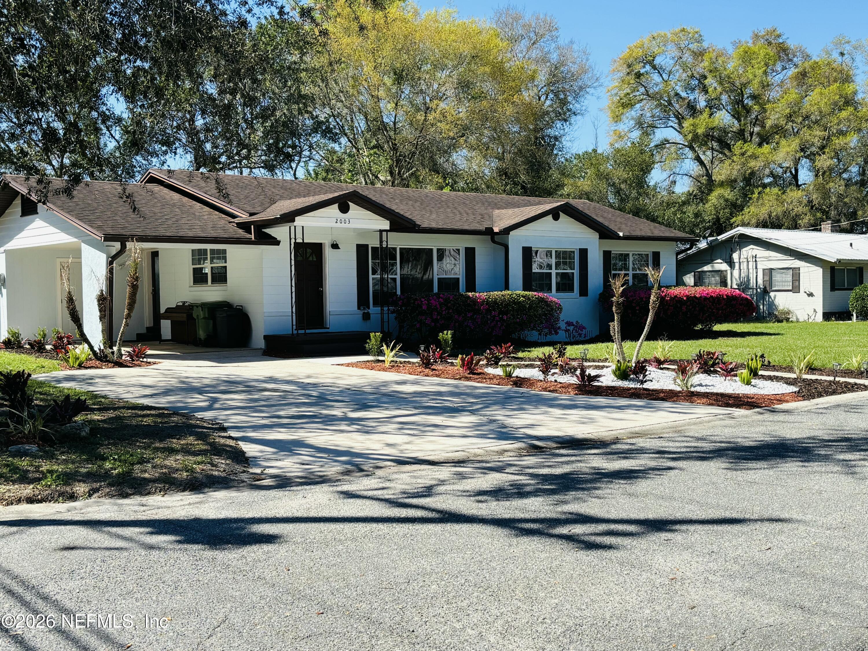 2003 Laurel Street Palatka, FL 32177 - Photo 1 of 31 a front view of a house with cars parked