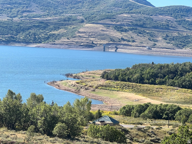 5207 North Oldgate Road Heber City, UT 84032 - Photo 58 of 58 Expansive waterfront setting featuring a natural shoreline, surrounding mature trees, and distant mountainous terrain