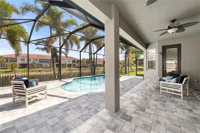 a roof deck with a table and chairs