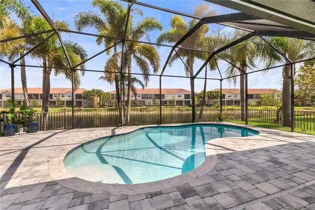 a swimming pool with an outdoor seating