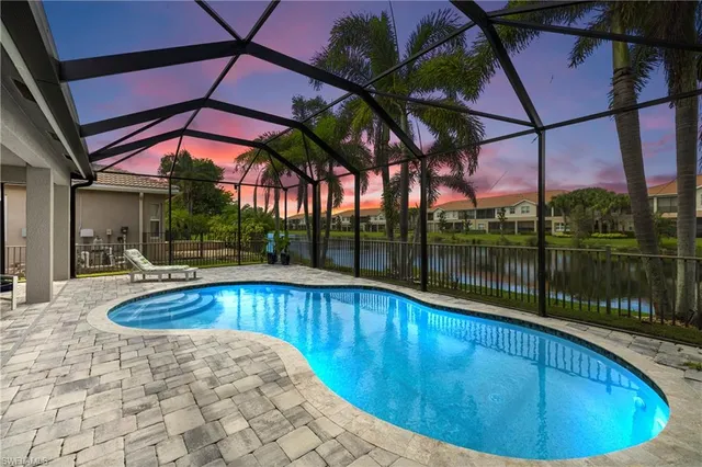 a view of a swimming pool with a patio