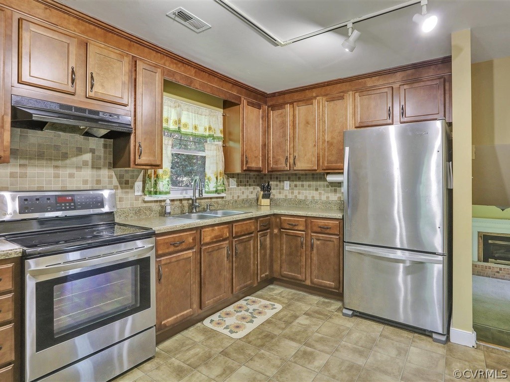 6400 Wilton Road Chesterfield, VA 23832 - Photo 8 of 27 a kitchen with granite countertop stainless steel appliances a refrigerator cabinets and a window