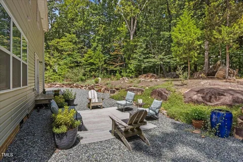 a backyard of a house with outdoor seating
