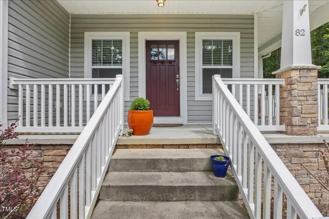 a balcony with wooden floor and outdoor space