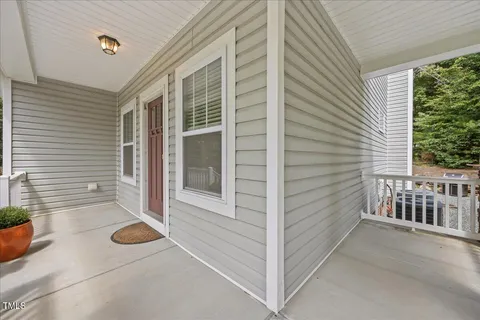a view of house with patio outdoor seating area