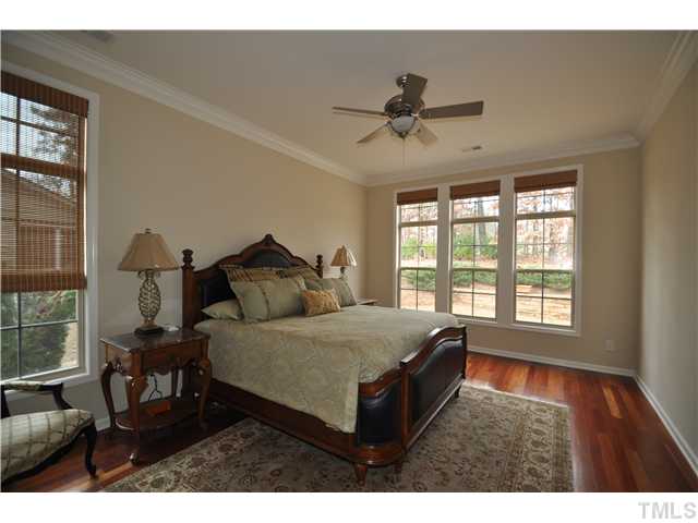 6217 Oconner Street Raleigh, NC 27617 - Photo 12 of 17 a bed room with a bed and a chair