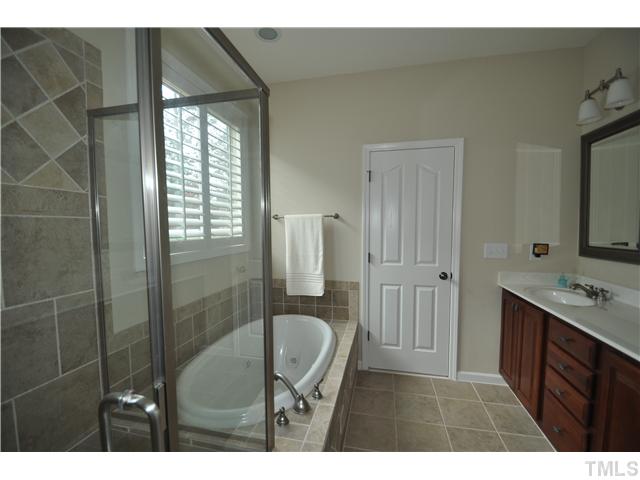 6217 Oconner Street Raleigh, NC 27617 - Photo 13 of 17 a bathroom with a sink and mirror