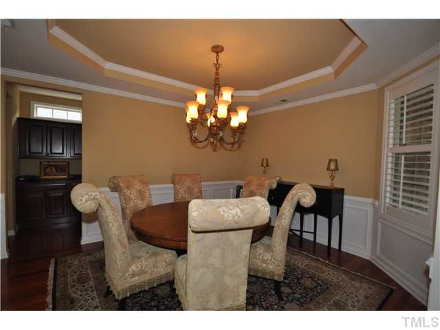 6217 Oconner Street Raleigh, NC 27617 - Photo 2 of 17 a view of a dining room with furniture and chandelier