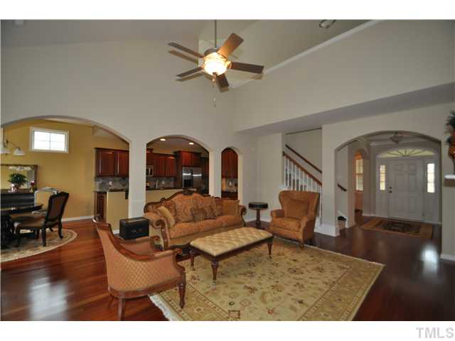 6217 Oconner Street Raleigh, NC 27617 - Photo 5 of 17 a living room with furniture and a chandelier
