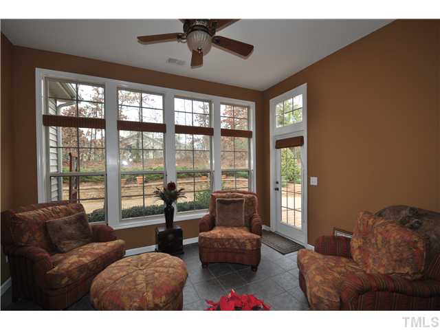 6217 Oconner Street Raleigh, NC 27617 - Photo 10 of 17 a living room with furniture and a floor to ceiling window