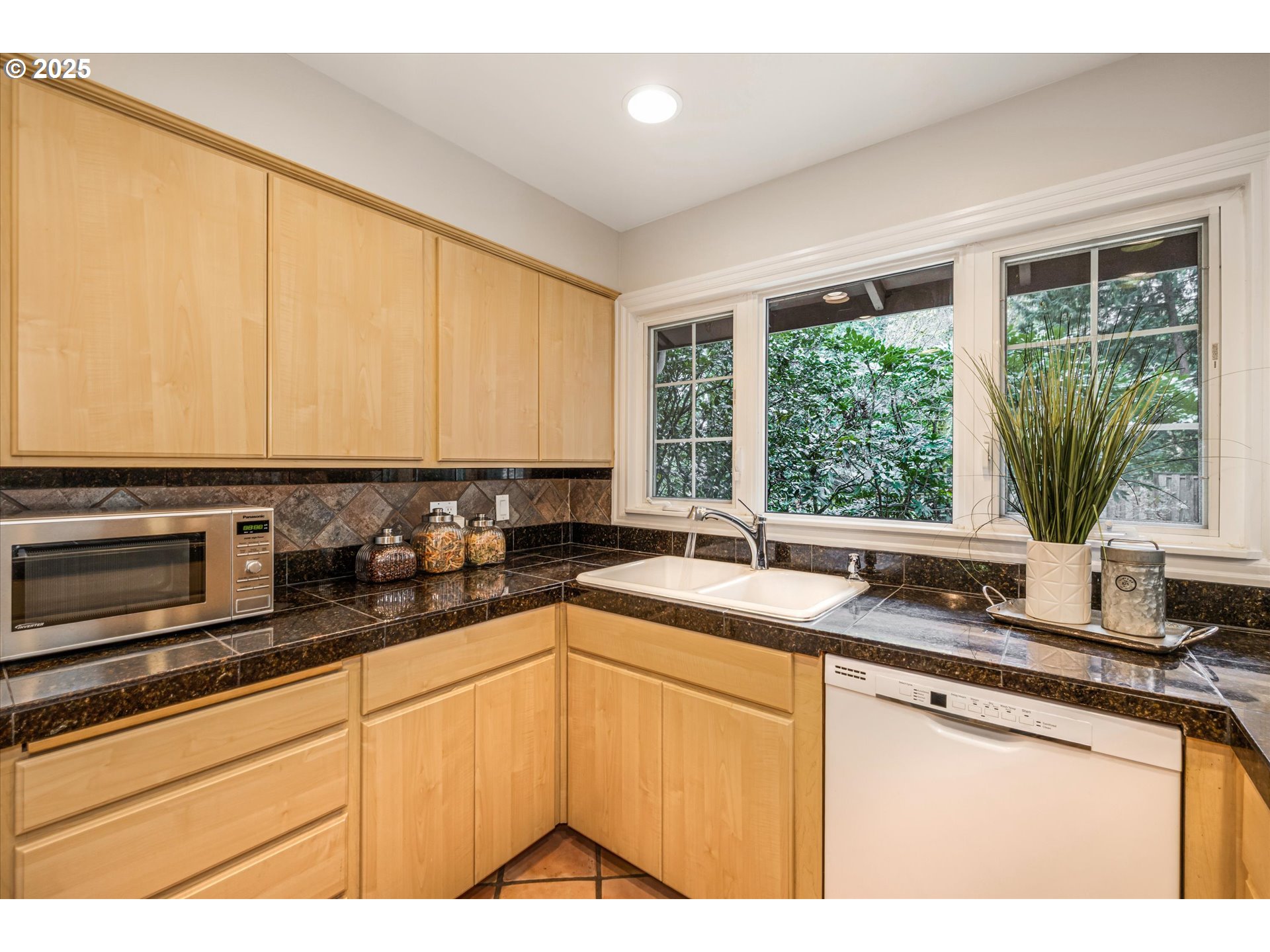 764 10th Street Lake Oswego, OR 97034 - Photo 17 of 41 a kitchen with granite countertop a sink and white cabinets