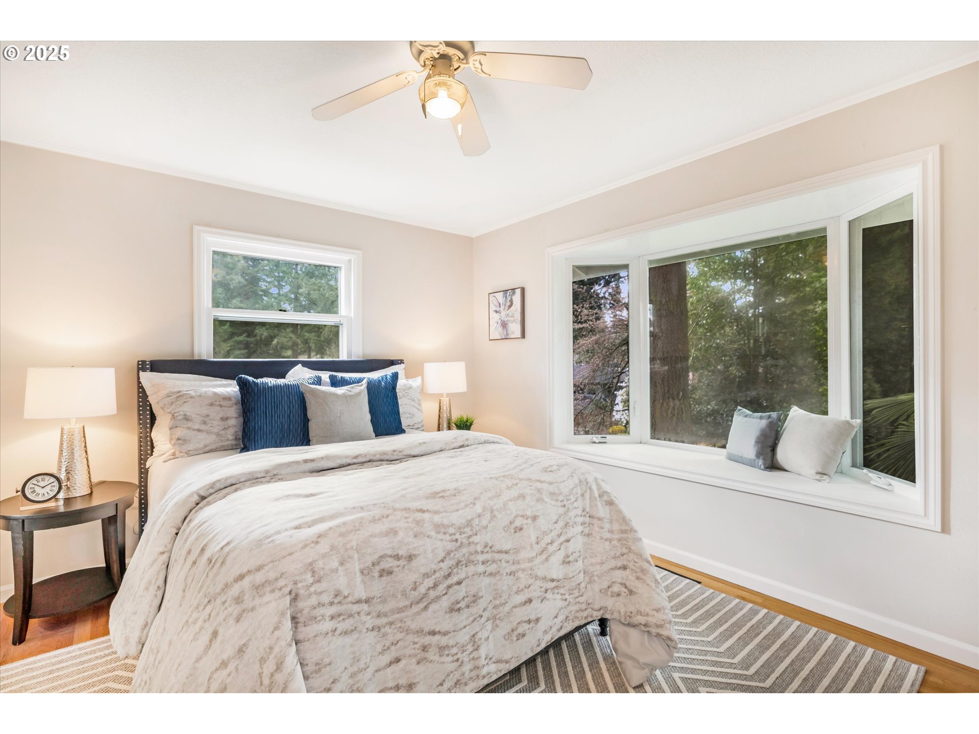 764 10th Street Lake Oswego, OR 97034 - Photo 28 of 41 a bedroom with a large bed and a large window