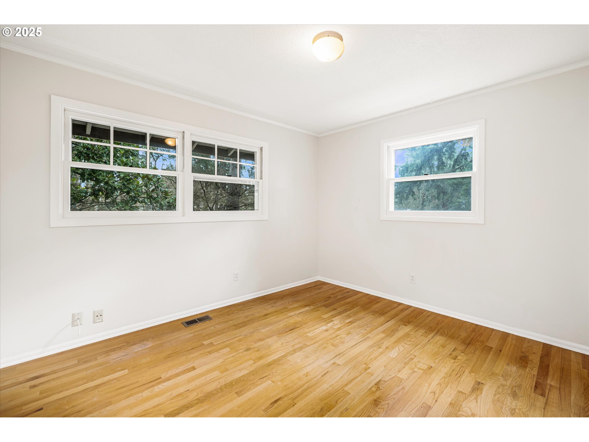 764 10th Street Lake Oswego, OR 97034 - Photo 30 of 41 an empty room with wooden floor and windows